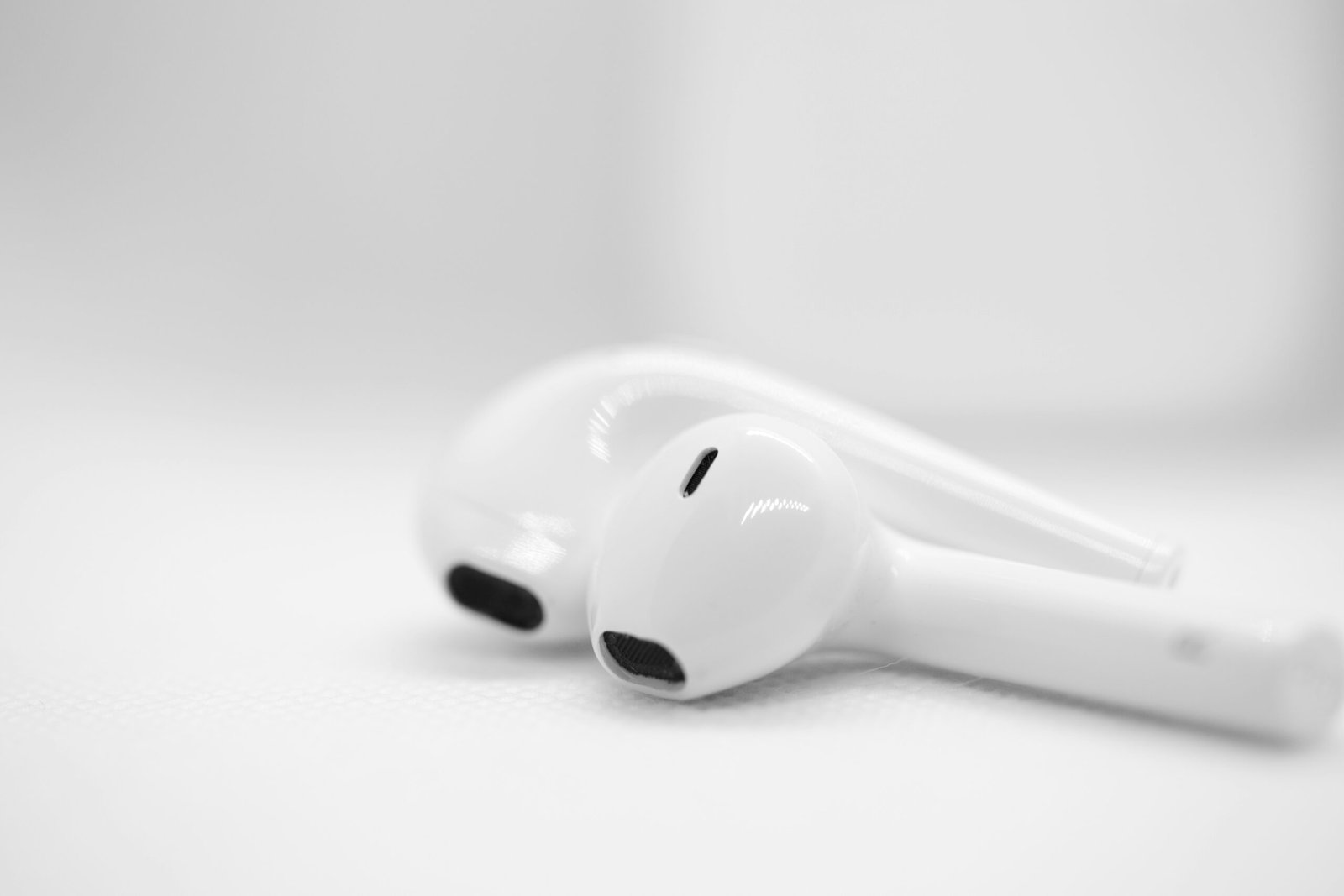 A pair of ear buds sitting on top of a table